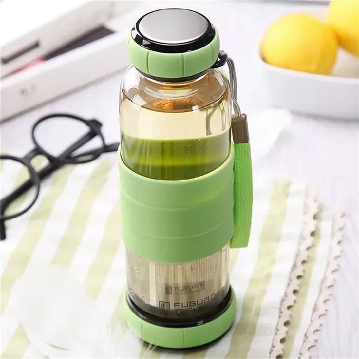 gourde en verre verte avec protection